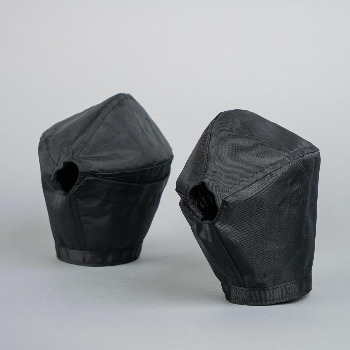 Two black phantom pogies on gray background.