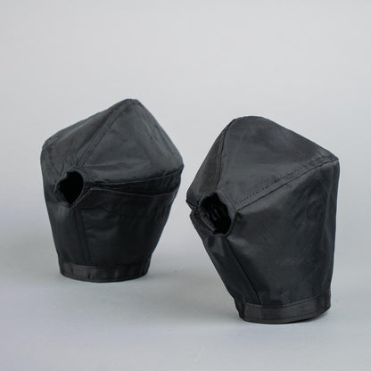 Two black phantom pogies on gray background.